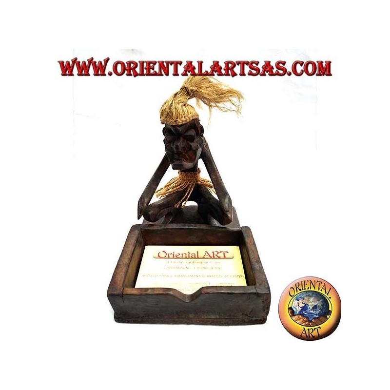 Business card holder with sculpture of a primitive man in teak wood