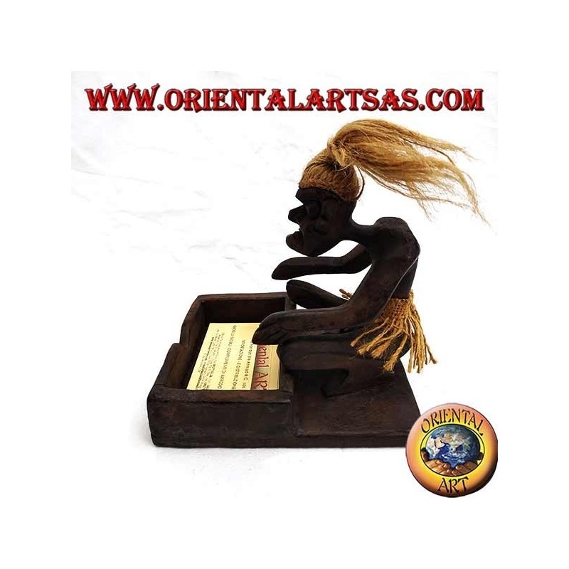 Business card holder with sculpture of a primitive man in teak wood