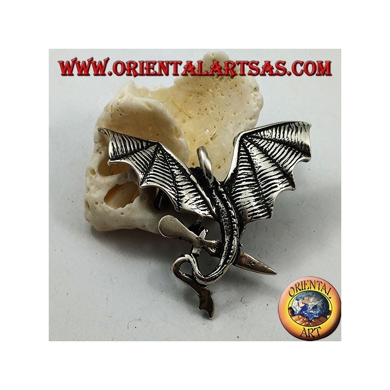 Silver dragon pendant with spread wings and dagger between the claws
