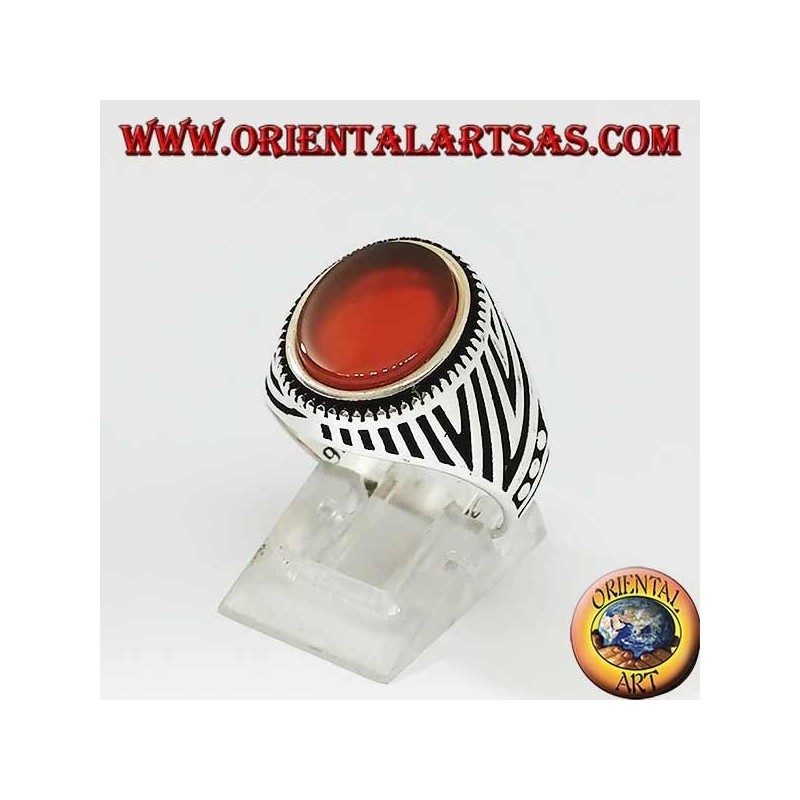 Silver ring with flat oval carnelian and engravings engraved on the sides