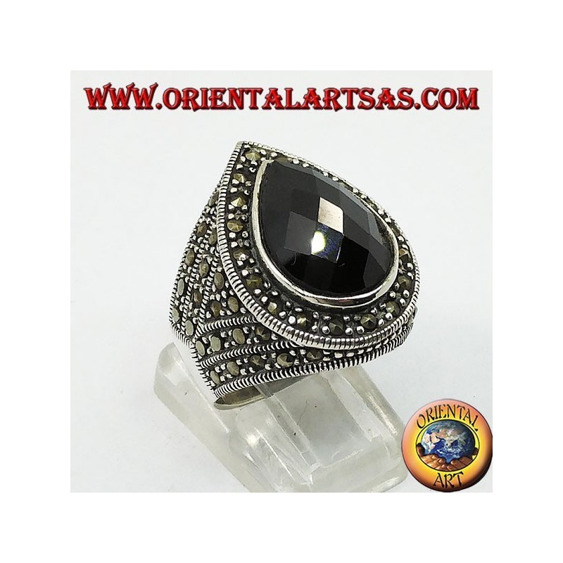 Silver ring with faceted teardrop onyx surrounded by marcasite