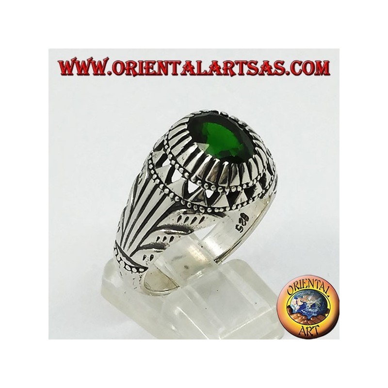 Silver ring with emerald-colored oval zircon set and carvings on the sides