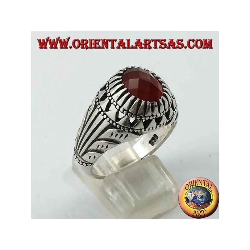 Silver ring with oval carnelian set and carvings on the sides