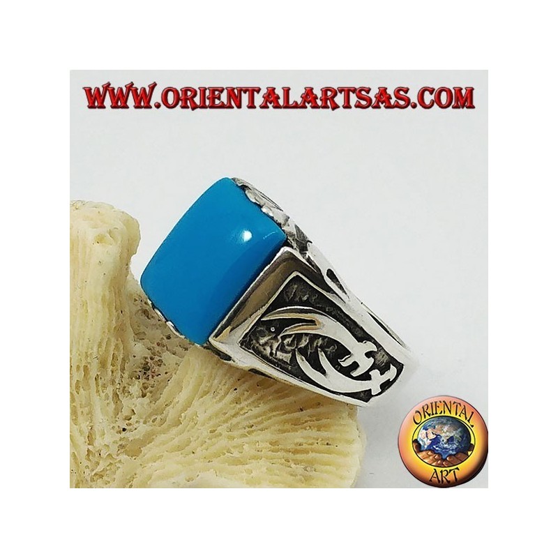 Anillo de plata con turquesa rectangular y cimitarras Zulfiqar de alto relieve en los laterales.