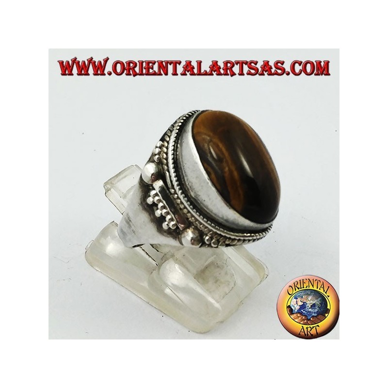 Anello in argento con occhio di tigre ovale a cabochon e decorazioni indiane