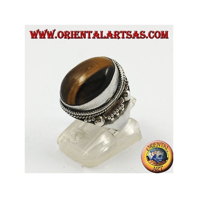 Silver ring with oval cabochon tiger's eye and Indian decorations