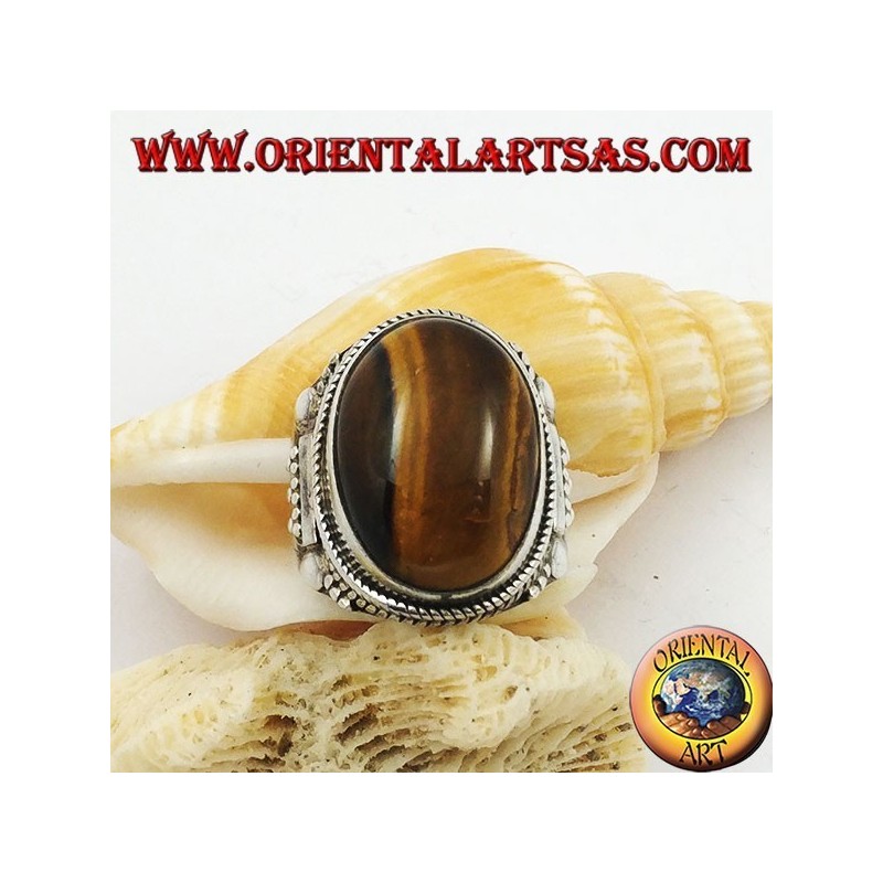 Anillo de plata con cabujón ovalado ojo de tigre y decoraciones indias