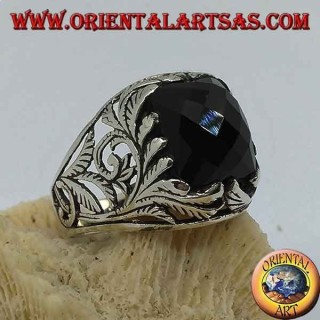 Silver ring with faceted rectangular onyx and openwork floral decorations