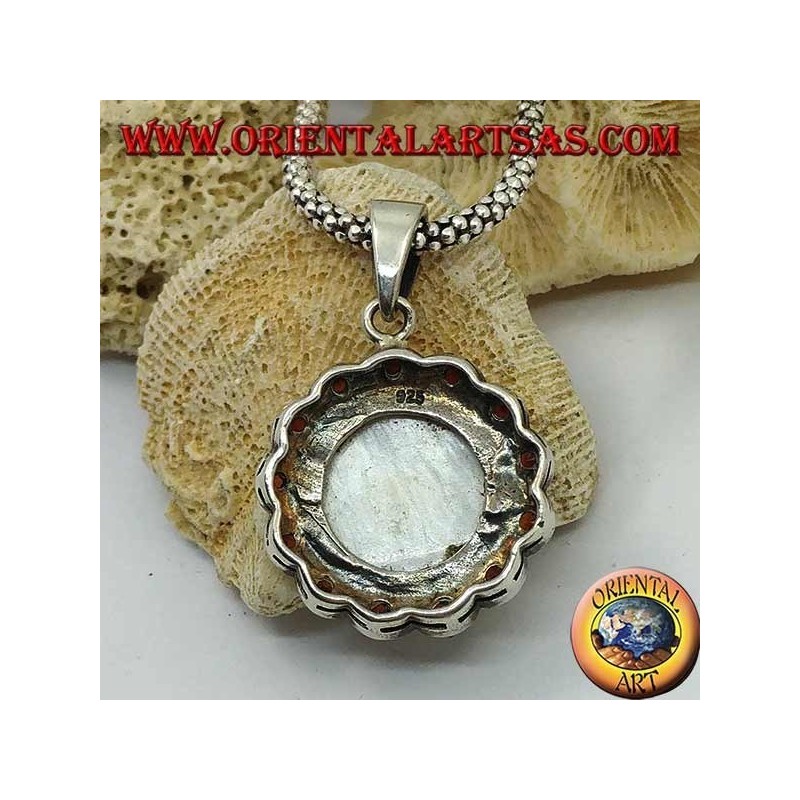 Silver cameo pendant on mother of pearl surrounded by silver and garnet flower