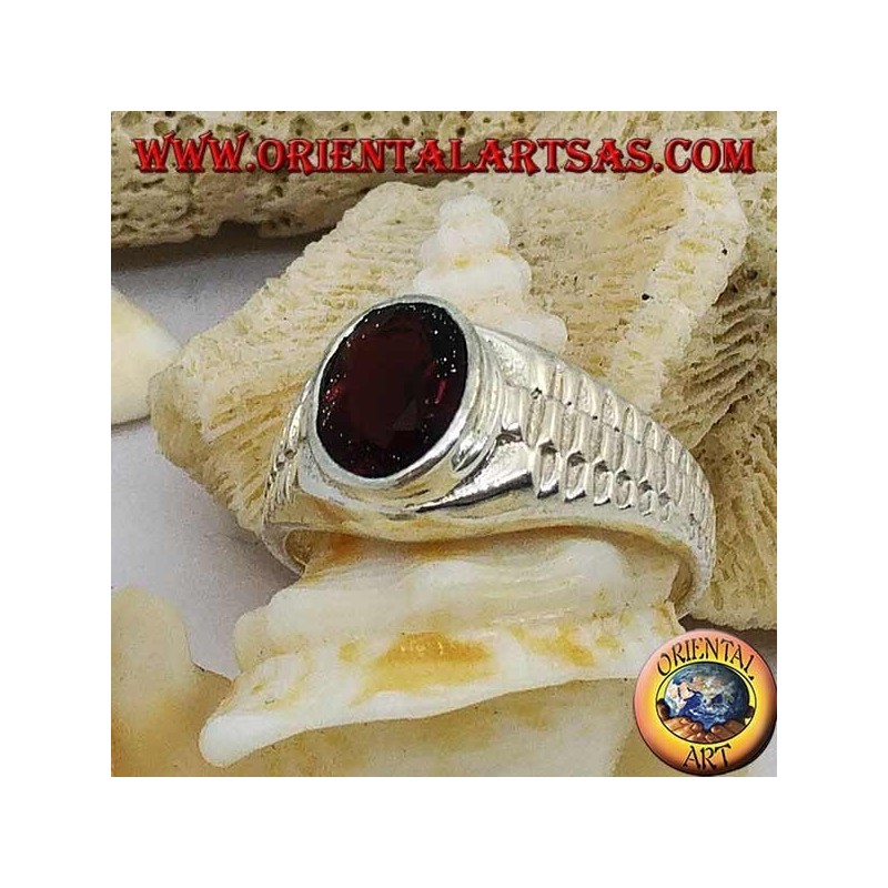 Silver ring with oval garnet and clock link decoration