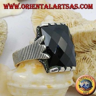 Silver ring with faceted rectangular onyx and clip frame