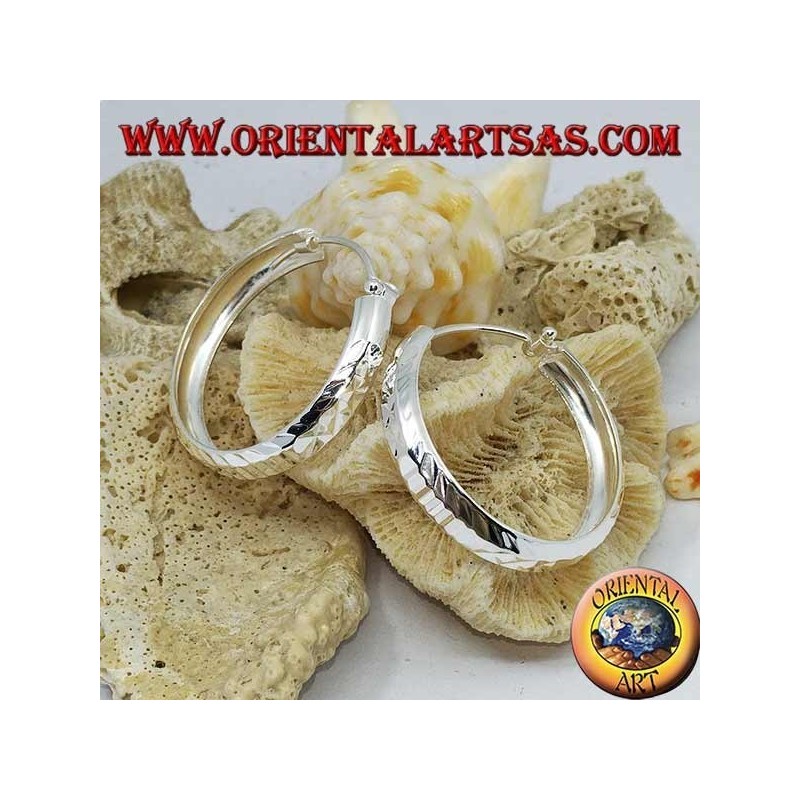 Wide circle silver earrings with 30 mm diamond cut.