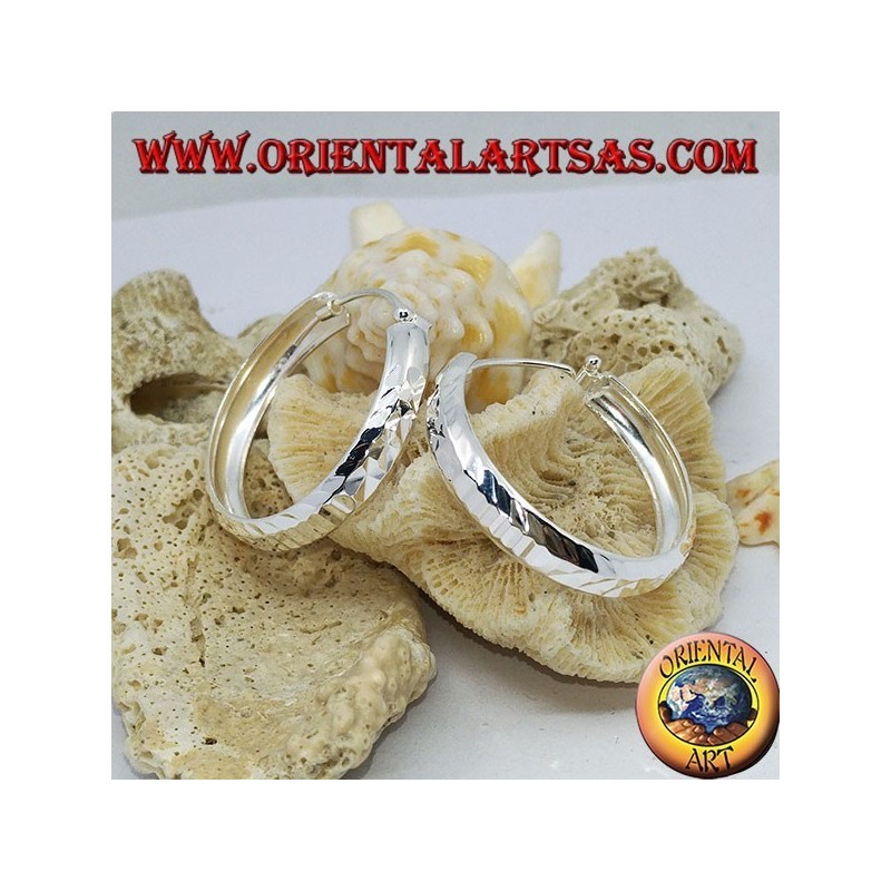 Wide circle silver earrings with 30 mm diamond cut.