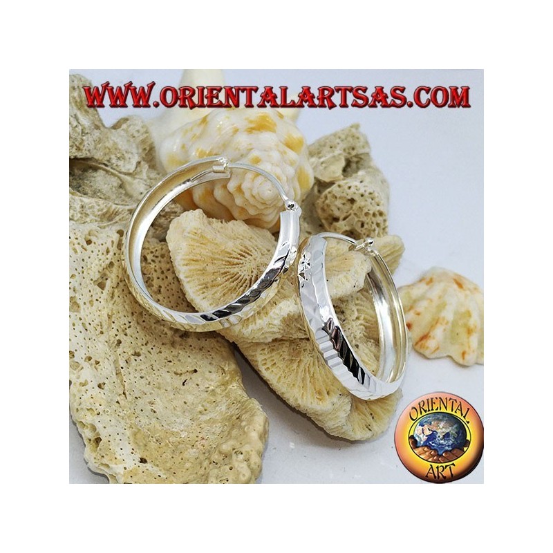 Wide circle silver earrings with 30 mm diamond cut.