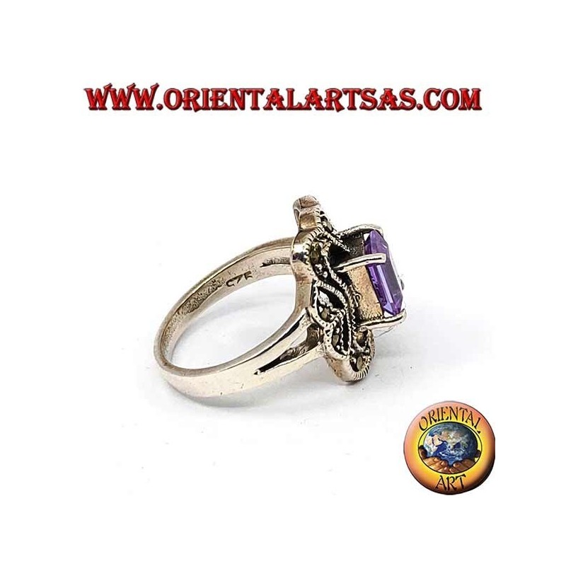 Beveled silver ring with rectangular amethyst set surrounded by marcasite