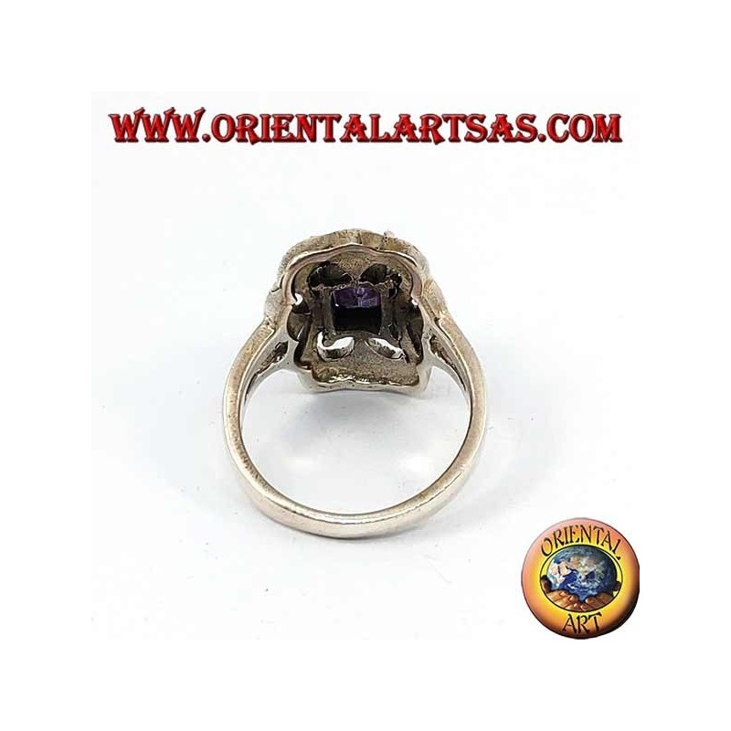 Beveled silver ring with rectangular amethyst set surrounded by marcasite