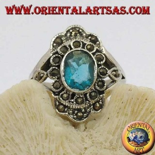 Anillo de plata margarita con topacio azul ovalado y marcasita