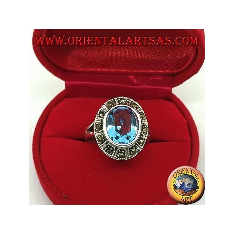 Large oval silver ring with blue topaz surrounded by marcasite