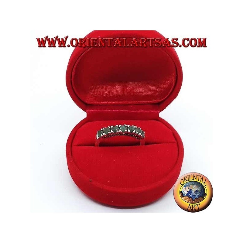 Band silver ring with a row of round emeralds set and marcasite