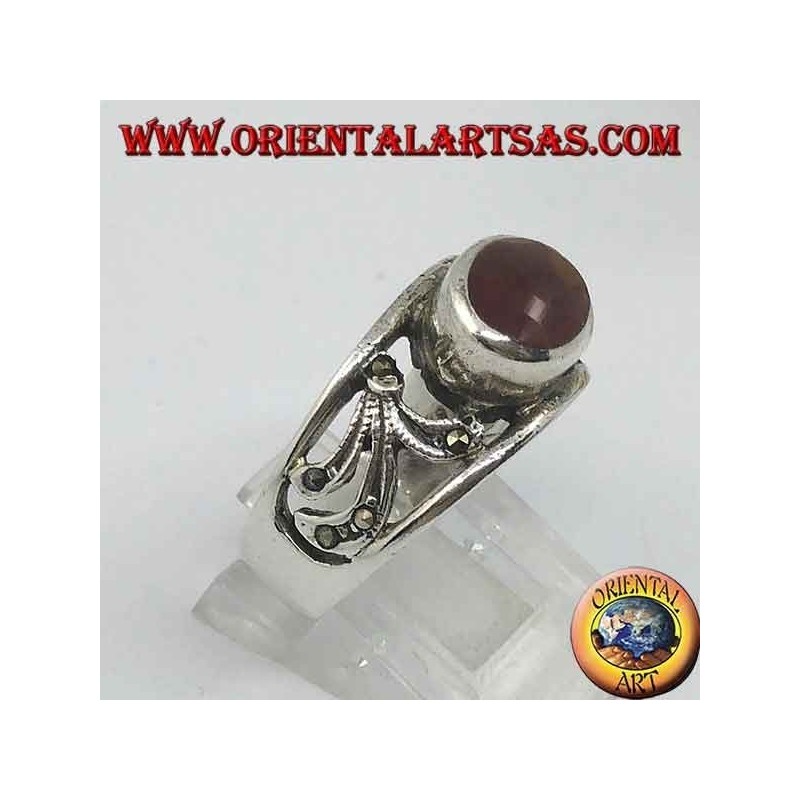 Silver ring with horizontal oval carnelian and floral decoration perforated with marcasite