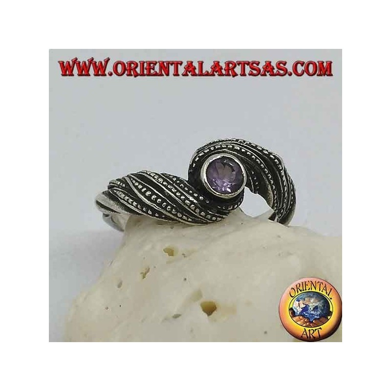 Silver ring with natural round amethyst in an interweaving of threads