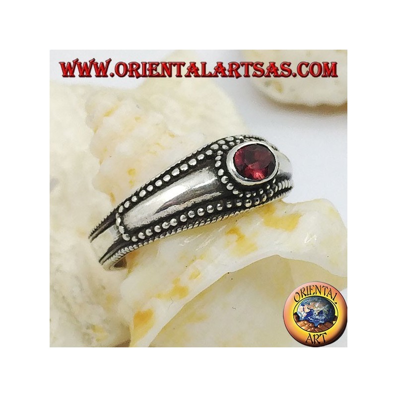 Silver ring with horizontal oval garnet and balls decoration