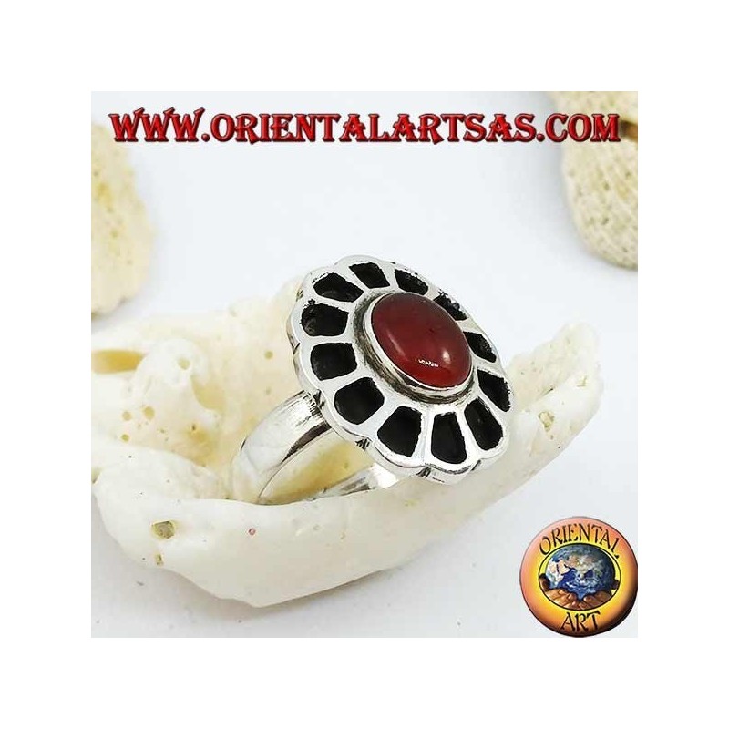 Silver ring in the shape of a flower with an oval carnelian and openwork petals