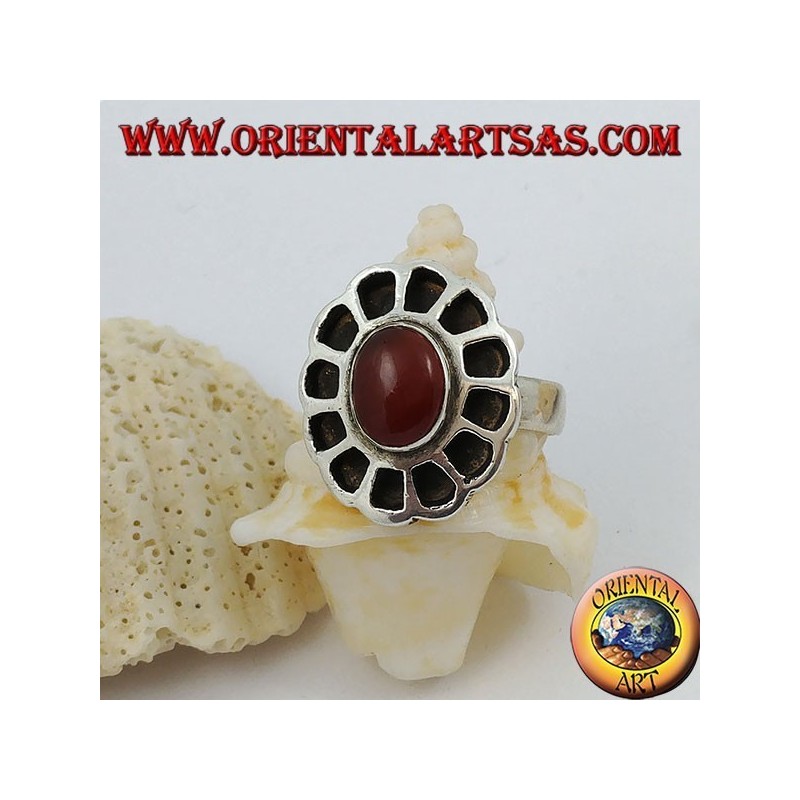 Silver ring in the shape of a flower with an oval carnelian and openwork petals