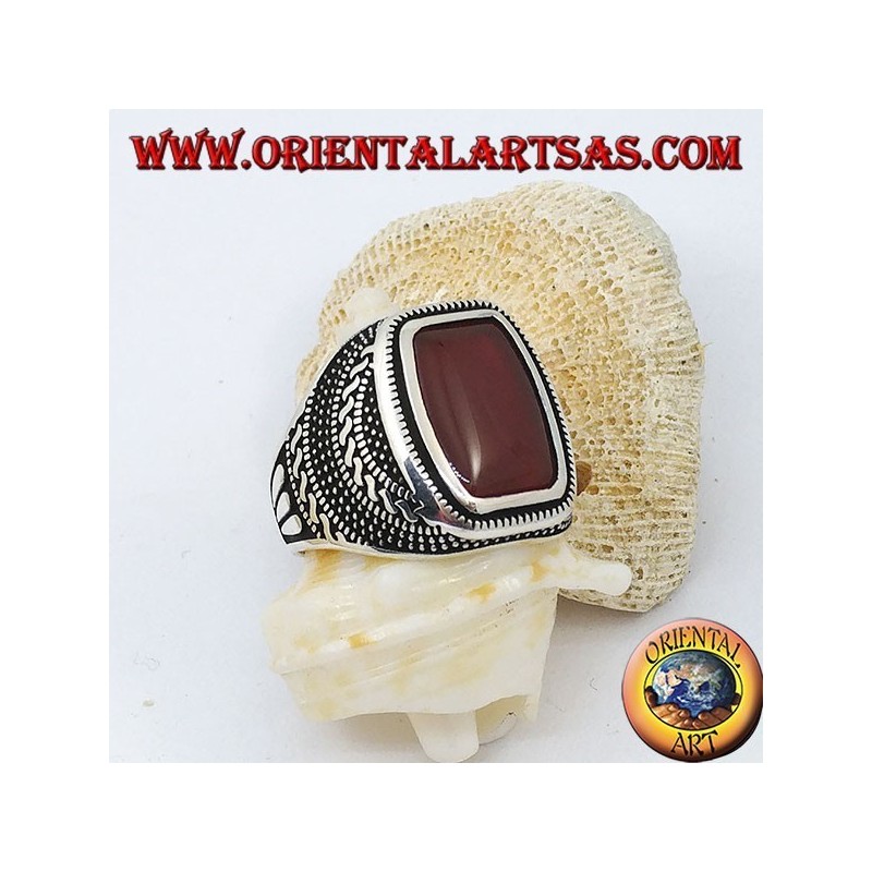 Silver ring with rounded rectangular carnelian in an engraved rose window