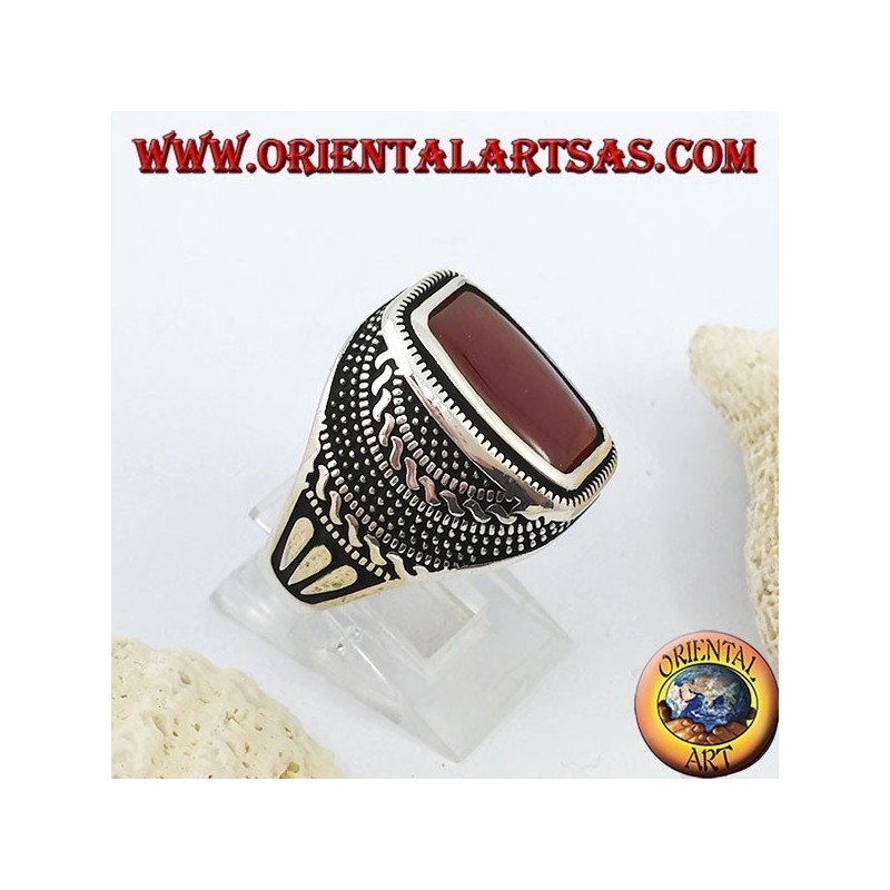 Silver ring with rounded rectangular carnelian in an engraved rose window