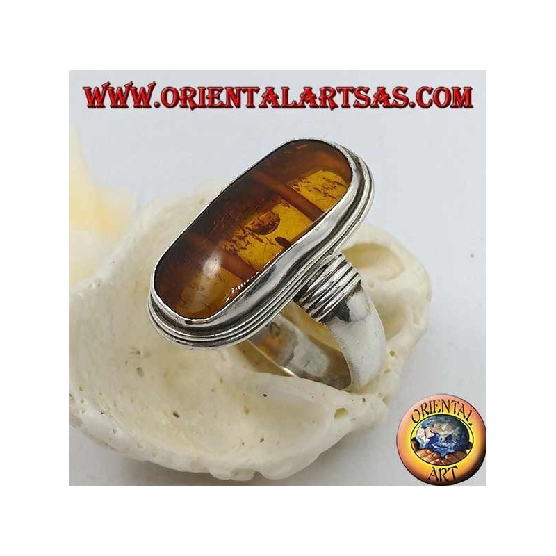 Silver ring with oval natural amber of ancient Tibetan origin and striped frame