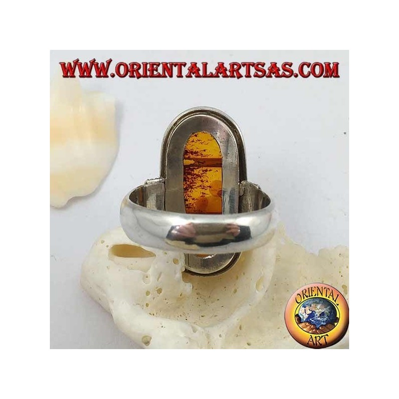 Silver ring with oval natural amber of ancient Tibetan origin and striped frame