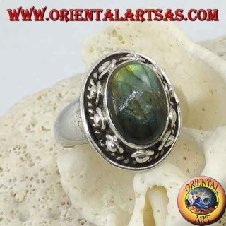Silver ring with oval labradorite surrounded by studs and braid