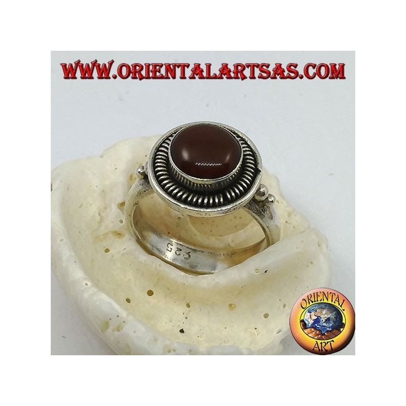 Silver ring with round carnelian raised in the circle and stripes