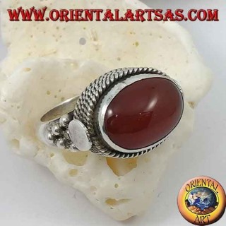 Silver ring with natural oval carnelian sideways surrounded by four rows of dots