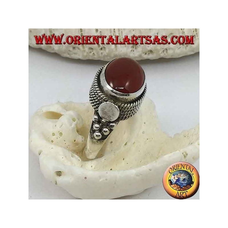 Silver ring with natural oval carnelian sideways surrounded by four rows of dots