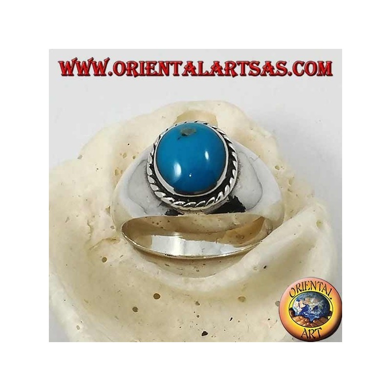 Bague en argent avec un cabochon ovale turquoise entouré d'une tresse