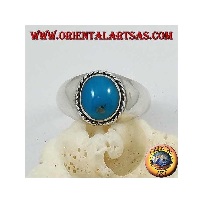 Silver ring with oval cabochon turquoise surrounded by a braid