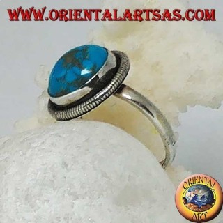 Silver ring with a round cabochon turquoise surrounded by a row of disks (16)