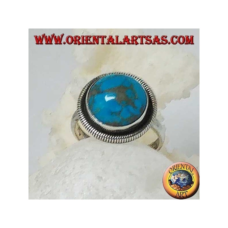 Silver ring with a round cabochon turquoise surrounded by a row of disks (16)