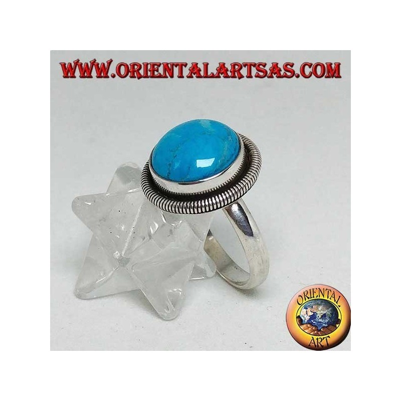 Silver ring with round cabochon turquoise surrounded by a row of disks (18)