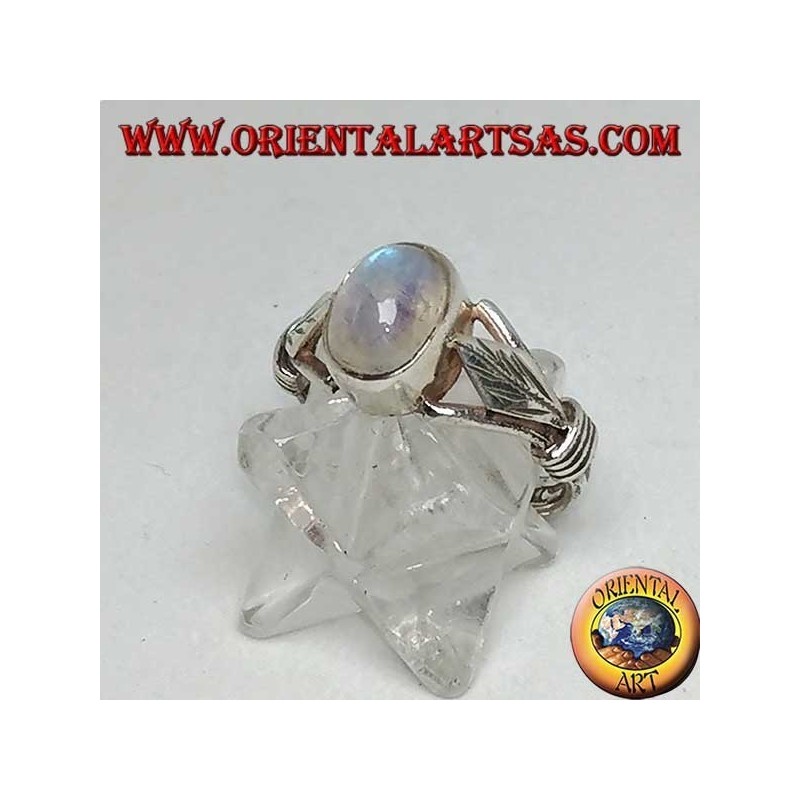 Silver ring with oval rainbow moonstone and rhomboid leaf with discs on the sides