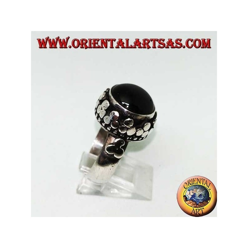 Silver ring with raised Black Star surrounded by disc clovers