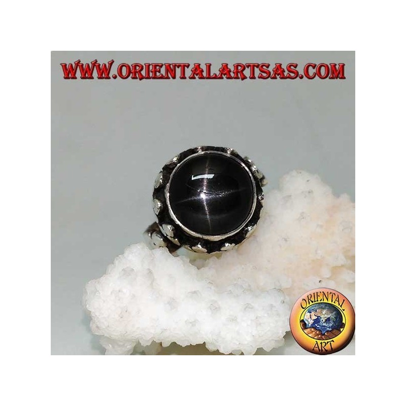 Silver ring with raised Black Star surrounded by disc clovers