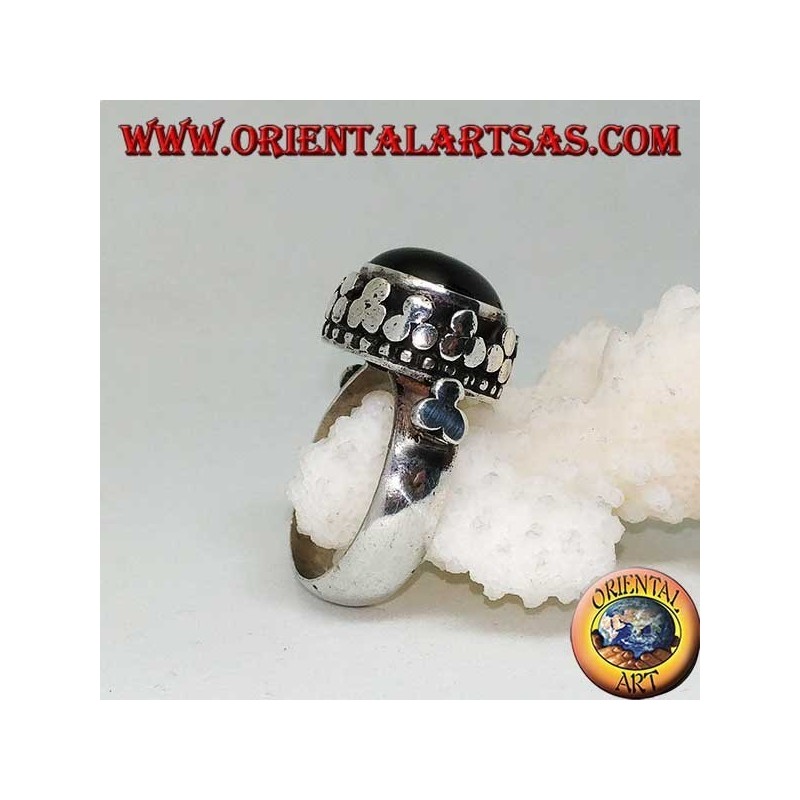Silver ring with raised Black Star surrounded by disc clovers