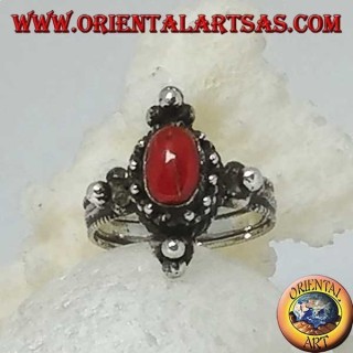 Silver ring with natural oval coral on a Tibetan setting with balls on the cardinal points