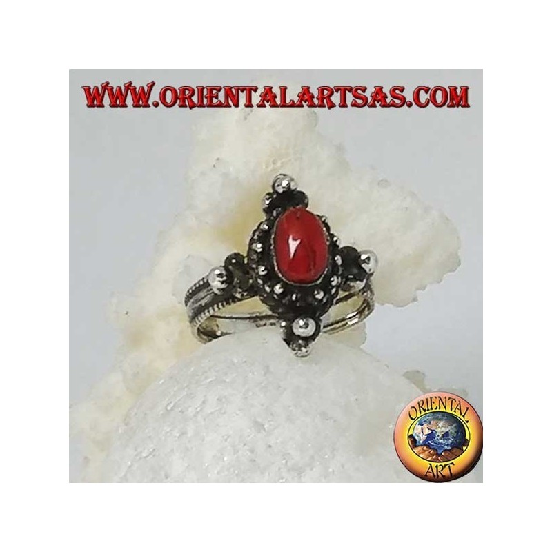 Silver ring with natural oval coral on a Tibetan setting with balls on the cardinal points