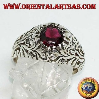 Silver ring with round natural garnet on a frame with openwork floral decoration