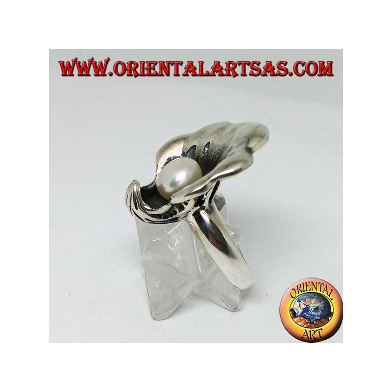 Silver ring with natural pearl in the oyster coat