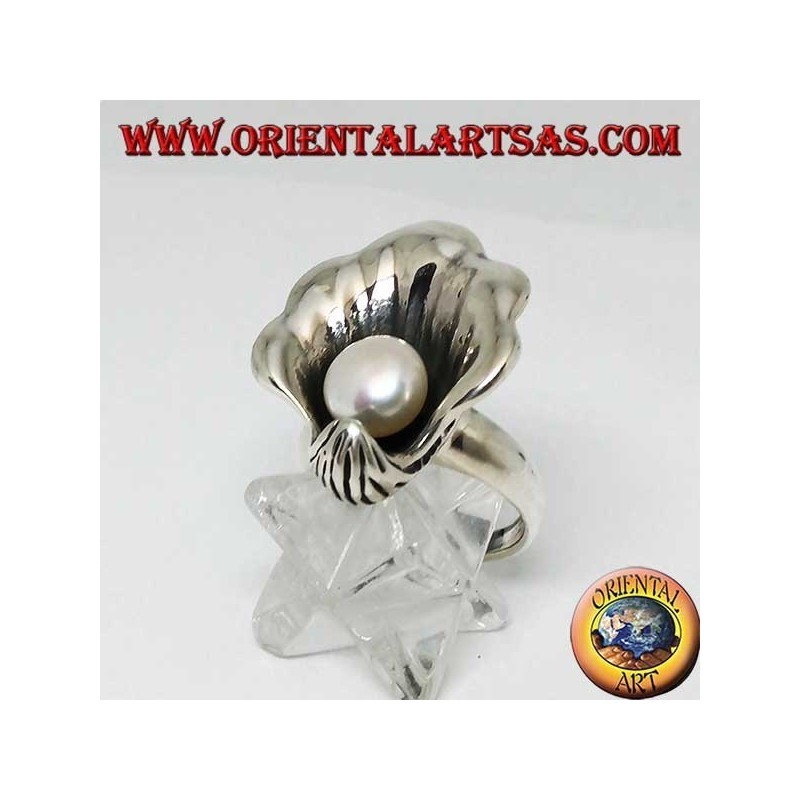 Silver ring with natural pearl in the oyster coat